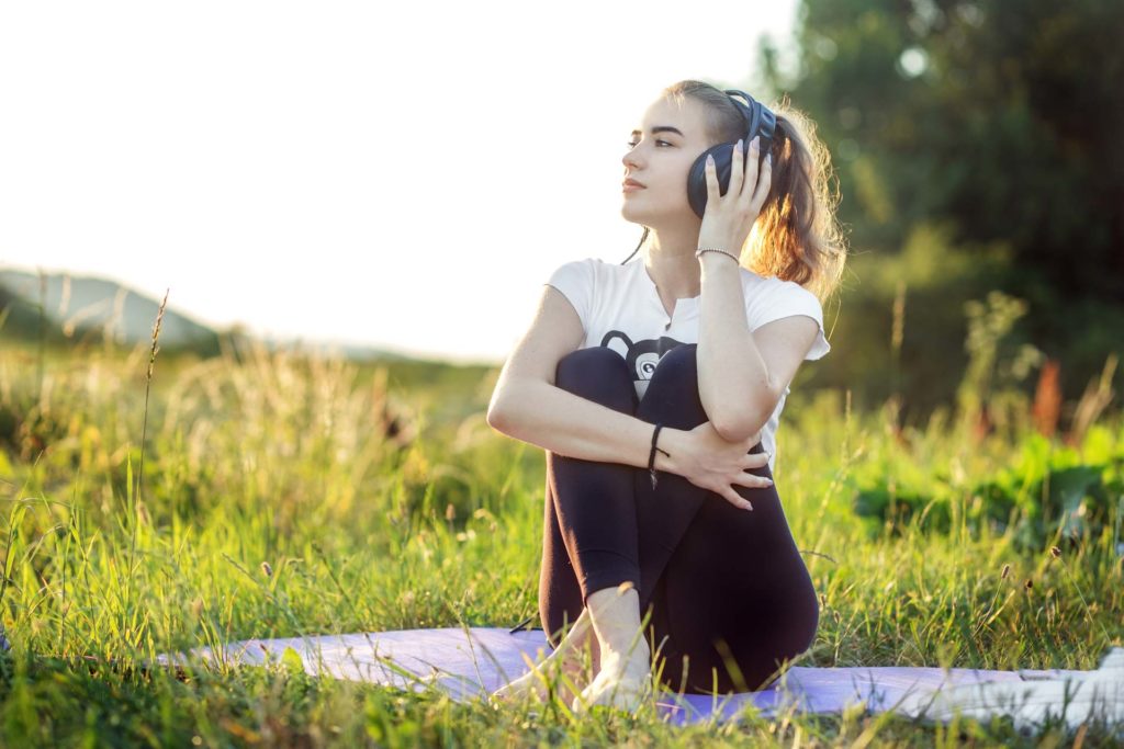 person relaxed while listening to music outside