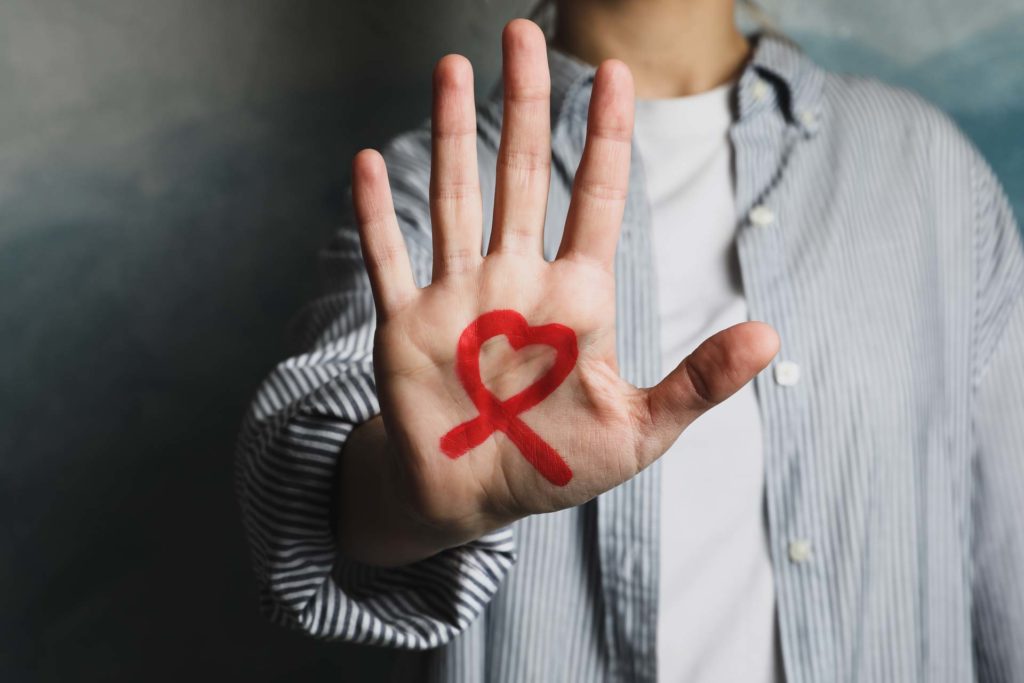 A hand with the hiv symbol