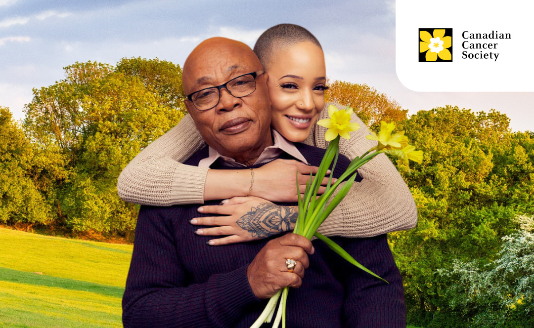 Two people hugging with daffodils in the hands