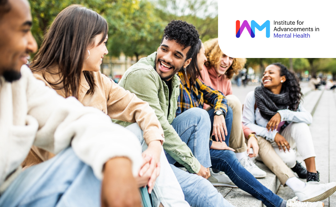 Young people between their 20s and 40s talking and laughing together. The logo of the Canadian Institute for Advancements in Mental Health is on the corner.